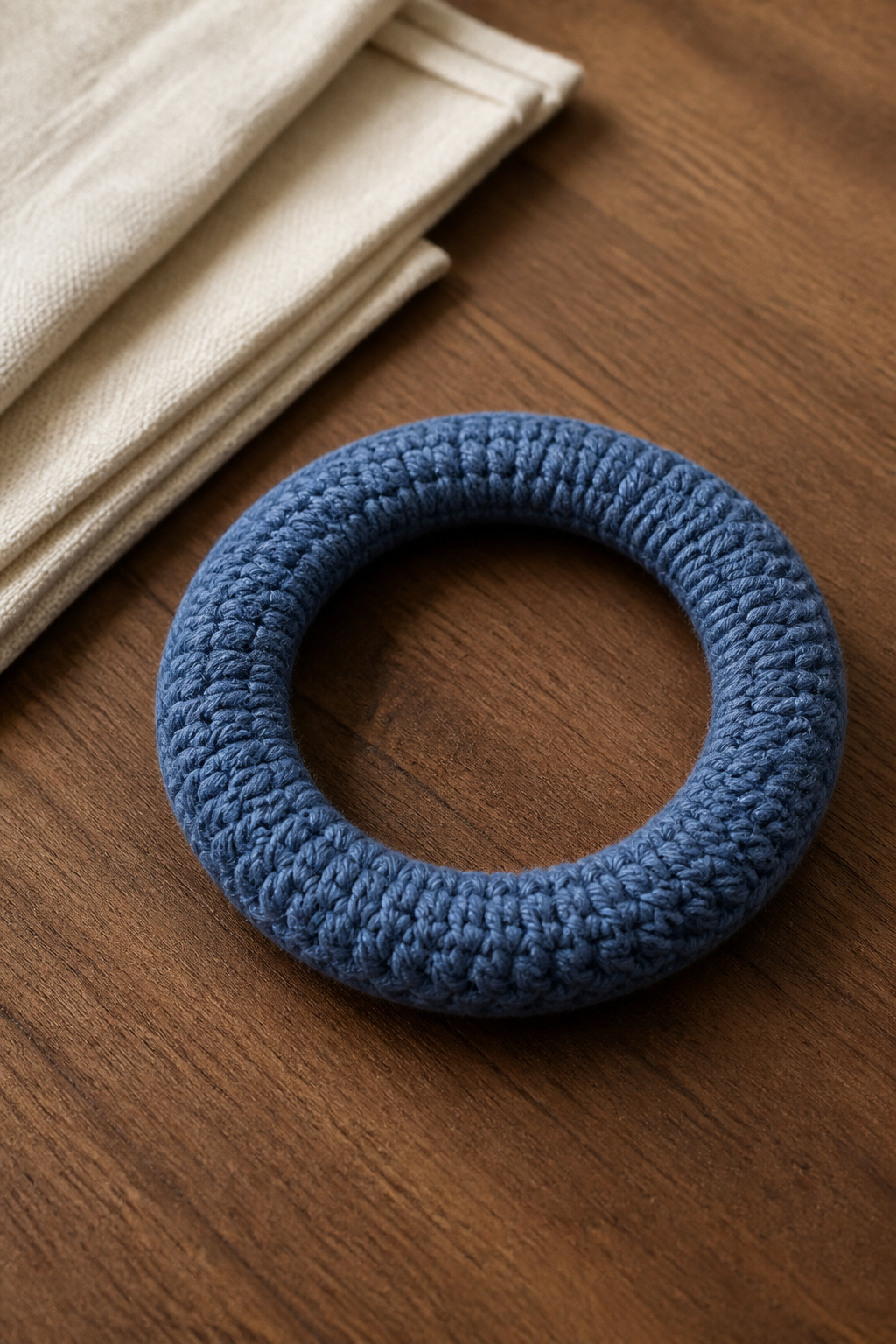 completed recycled crochet bag handle covered in dusty blue yarn