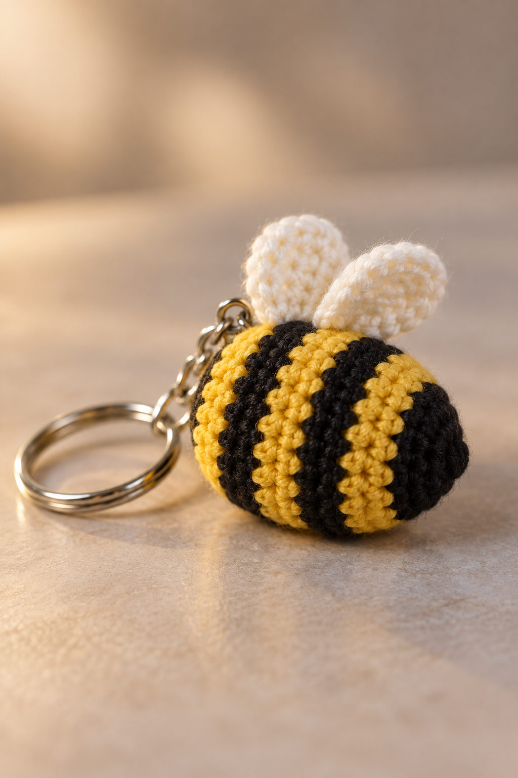 crochet bee keychain pattern body with yellow and black stripes