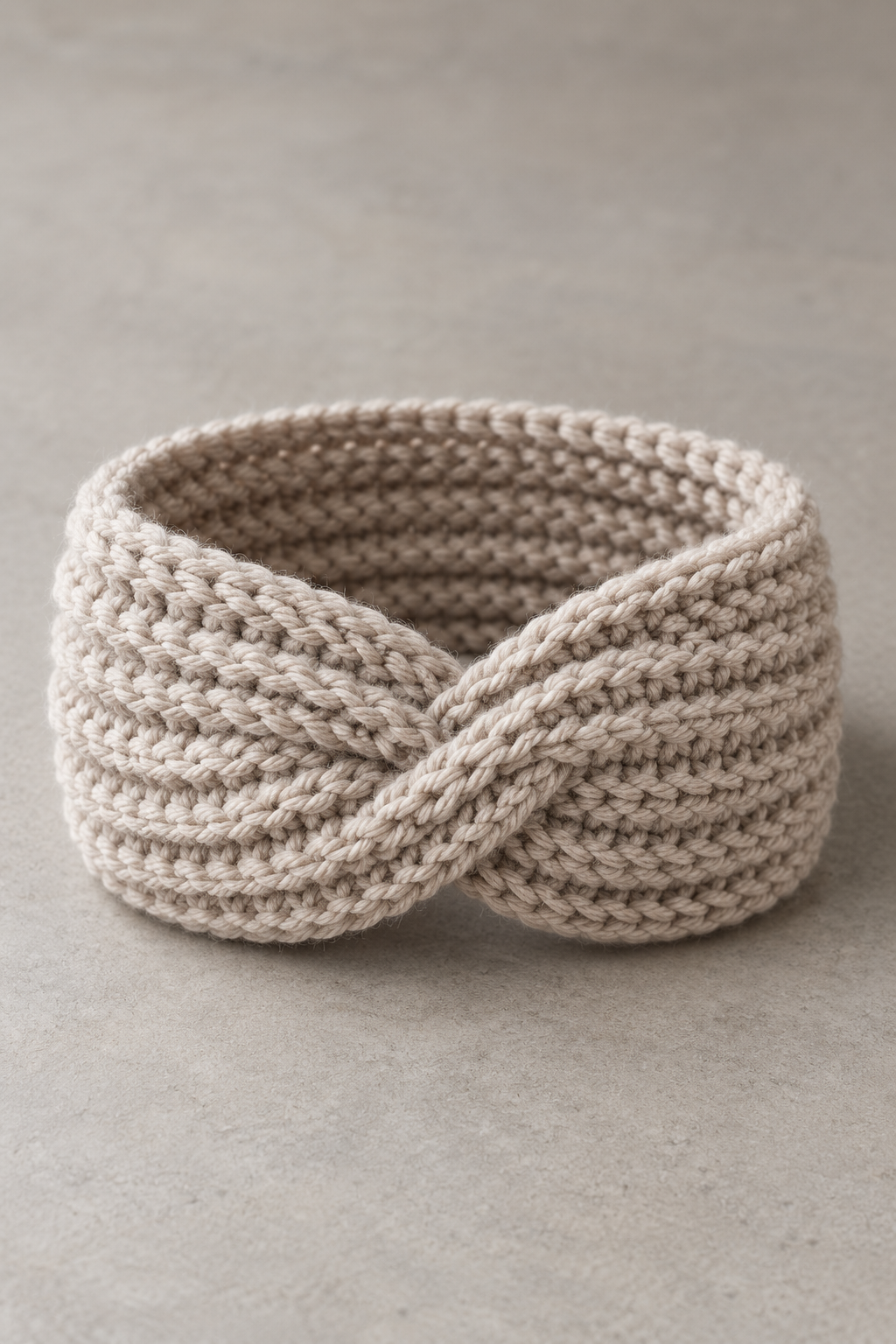 Finished crochet ear warmer in a soft neutral palette