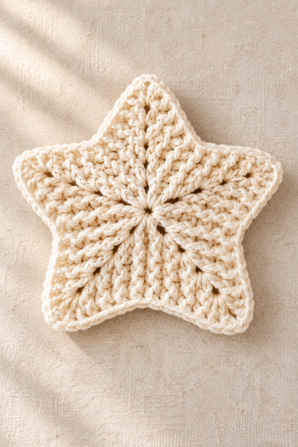 Finished star crochet washcloth styled with simple essentials