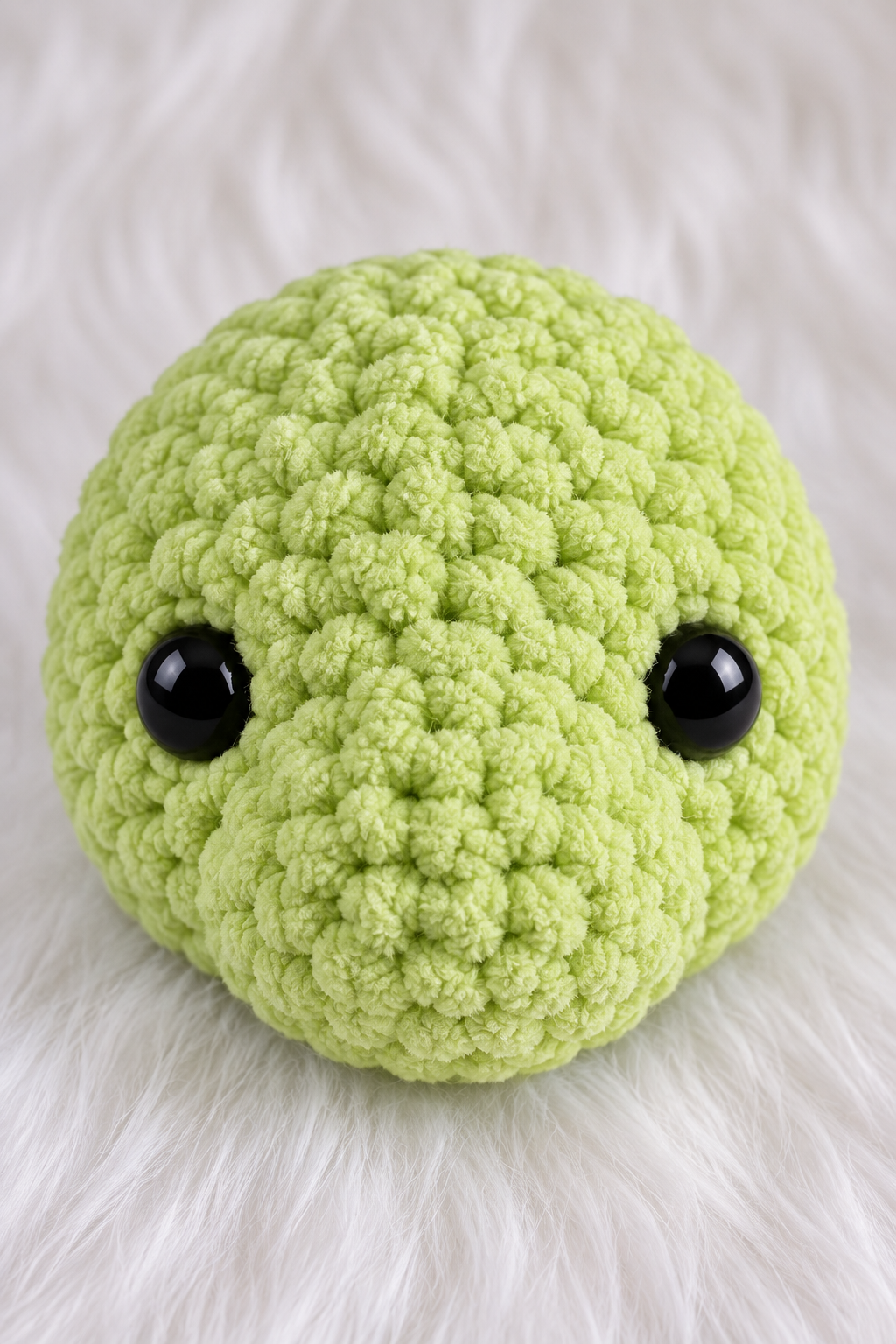 Close-up of crocheted turtle head