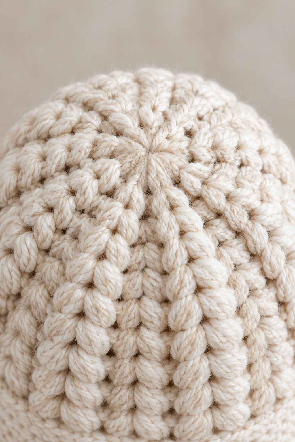 Close view of puff stitch crochet hat crown shaping